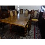 A modern oak refectory style dining table with rectangular top, carved frieze, on baluster turned
