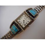 A gentleman's wristwatch by Roy King in a silver case, on a silver bracelet with turquoise