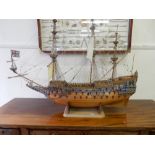 A large scratch built wooden model of a galleon, on rectangular base and one other model of a boat