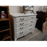 A French style cream sprayed chest fitted four drawers, on scrolling cabriole legs - 39in. wide