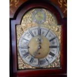 An Edwardian longcase clock with pierced brass dial, silvered chapter ring, chime/silent and seconds