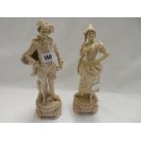 A pair of Royal Dux figures, male and female in pink - 11 1/2in. high and a Continental group of a