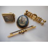 A Chinese gold coloured metal bar brooch set two pearls, a gold coloured metal bar brooch set blue