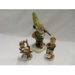 A Goebel model of a gnome and two Goebel Hummel figures including Apple Tree Girl