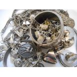 A quantity of silver and silver coloured metal jewellery including rings, coin bracelet, bangle,
