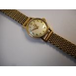 A lady's Omega wristwatch in a 9ct. gold case, on a 9ct. gold bracelet