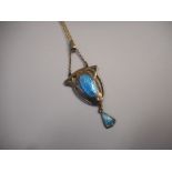 A sterling silver pendant with blue enamel by Charles Horner, on a silver chain