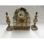 An Art Deco French mantel clock with circular white enamel dial, in a variegated pink marble