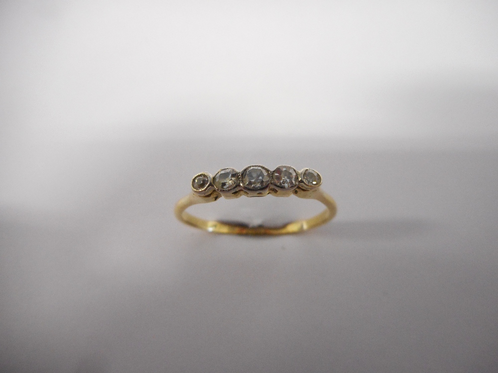 A lady's ring set centre sapphire flanked to each side by two diamonds, on a gold shank, a lady's - Image 2 of 3