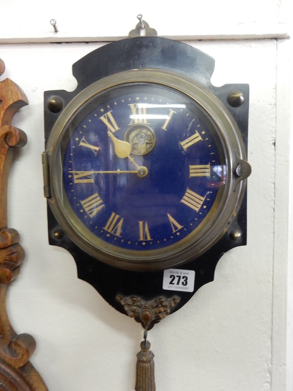 A 19th Century French sedan clock with blue enamel dial, gilt numerals, in a brass case, on ebonised