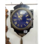 A 19th Century French sedan clock with blue enamel dial, gilt numerals, in a brass case, on ebonised