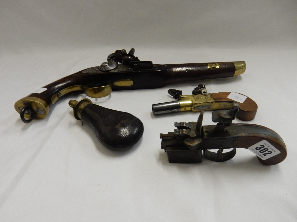 Three 19th Century pistols, one engraved John Jones London and a leather covered powder flask