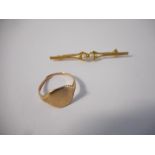 A 9kt. gold bar brooch set two pearls and a gentleman's gold signet ring (cut)