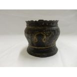 An Eastern bronzed small jardiniere decorated all round with animals