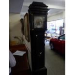 A longcase clock with brass dial, silvered chapter ring, pierced spandrels, striking movement on