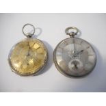 An openface pocket watch with silvered dial, gold coloured numerals, seconds dial, in a silver