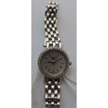 Ladies 18ct White Gold Tissot Quartz Watch with MOP Face - 12 o'clock diamond and a Diamond Bezel.