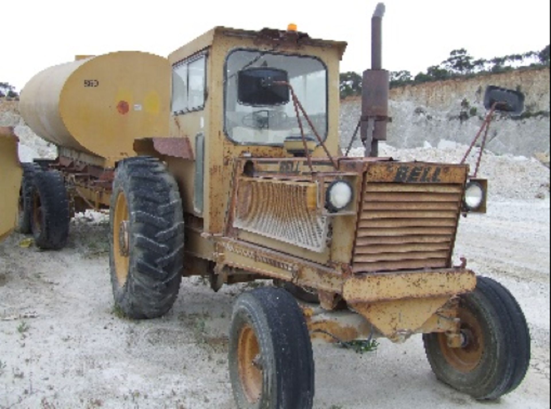 BELL 1206 TRACTOR WITH WATER TRAILER