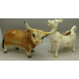 A Beswick cow creamer and a figure of a bull
