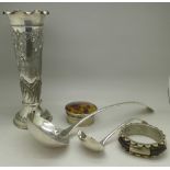 A large plated ladle, one smaller, a plated vase,