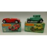 Two Matchbox model vehicles with boxes,