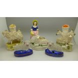 Staffordshire style figures; a pair of spill holders, a pair of pen holders and a figure group,
