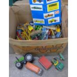 A collection of die-cast vehicles, mainly agricultural vehicles, playworn,