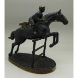 A table lighter in the form of a horse and jockey, 14.