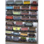 A collection of thirty-one model railway wagons