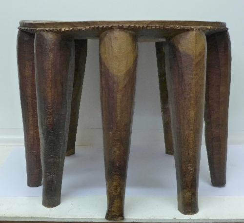 A Nigerian Nupe tribal stool with nine legs