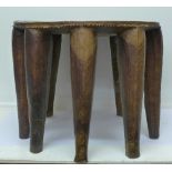 A Nigerian Nupe tribal stool with nine legs