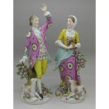 A pair of figures with gold anchor mark, possibly Chelsea,