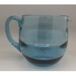 A 1930's Kosta blue ribbed hand blown glass jug, designed and signed by Elis Bergh, 14.
