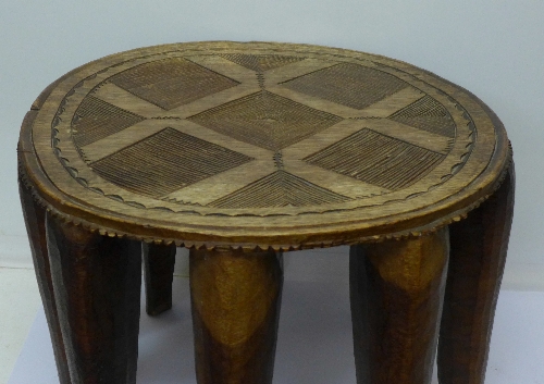 A Nigerian Nupe tribal stool with nine legs - Image 2 of 3