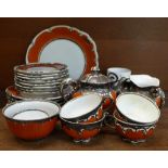 A twenty-seven piece porcelain tea service with applied silver decoration comprising a cake plate,