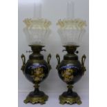 A pair of late 19th Century painted, brass mounted oil lamps, the glass shades signed Vianne, 64cm,