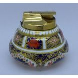 A Royal Crown Derby Imari table lighter, damaged,