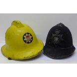 A fireman's helmet and a policeman's helmet