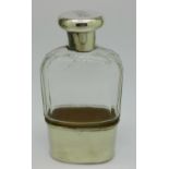 A silver topped glass spirit flask, with plated cup,