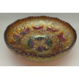 A carnival glass bowl decorated with Welsh dragons
