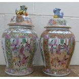 A pair of Chinese famille rose lidded vases with signature to base