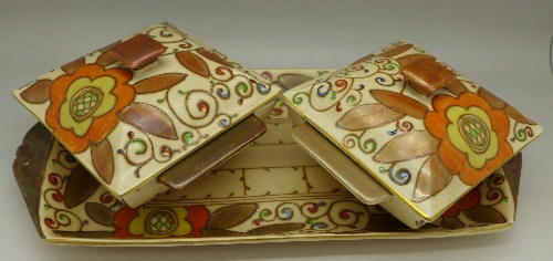 A Charlotte Rhead Bursley-Ware rectangular tray with two lidded pots