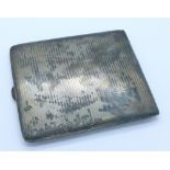 A silver cigarette case,