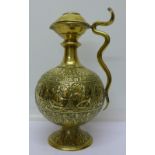 A Persian brass embossed ewer,