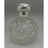 A silver topped glass scent,