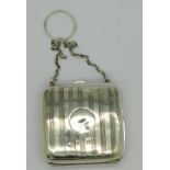 A lady's silver purse with chain