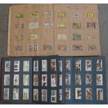 Two albums of cigarette cards including Wills and Westminster and a part album of Matchbox labels