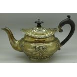 A silver bachelors teapot decorated with swags, London 1904, Holland, Aldwinckle & Slater,