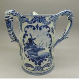 A Royal Bonn Delft three handled mug, small chip to one handle, 14.