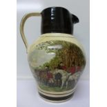 A large jug decorated with hunting scenes, marked Tranquiline on base,